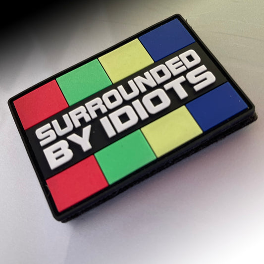 TACTICAL INNOVATIONS: Surrounded By Idiots PVC Morale Patch, 3"x2"